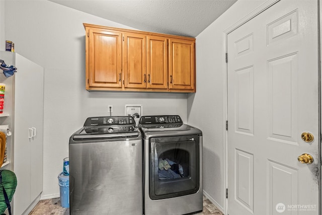 5309 NE 75th Ave, Vancouver, WA 98662 - laundry room featuring washing machine and clothes dryer, cabinet space, and a textured ceiling