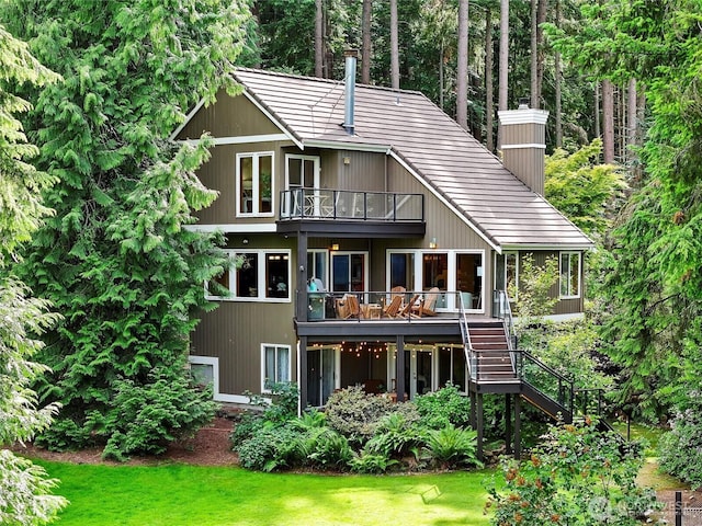18608 SE 58th St, Issaquah, WA 98027 - rear view of house with a balcony, stairs, a chimney, and a yard