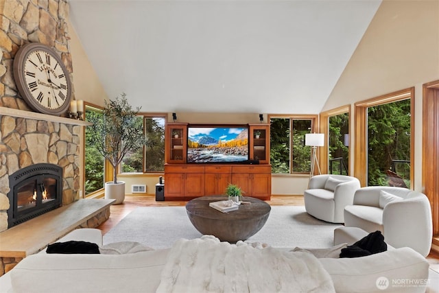 18608 SE 58th St, Issaquah, WA 98027 - living area featuring wood finished floors, high vaulted ceiling, and healthy amount of natural light