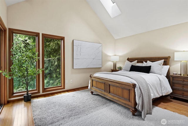 18608 SE 58th St, Issaquah, WA 98027 - bedroom featuring a skylight, hardwood / wood-style flooring, and high vaulted ceiling