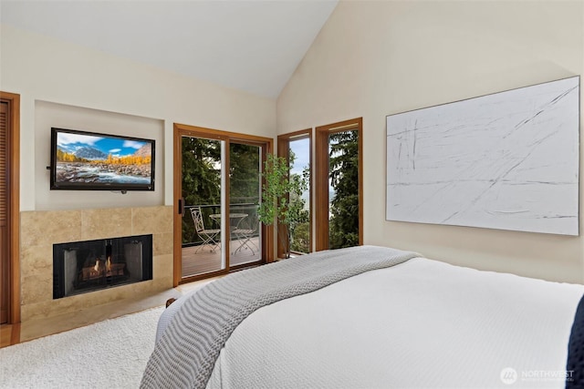 18608 SE 58th St, Issaquah, WA 98027 - carpeted bedroom with access to exterior, high vaulted ceiling, and a fireplace