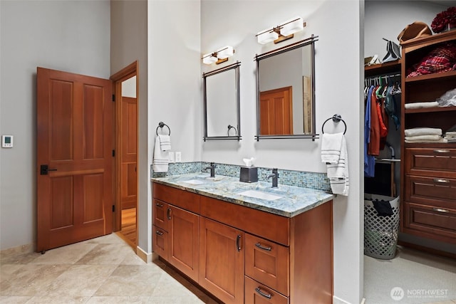 18608 SE 58th St, Issaquah, WA 98027 - bathroom featuring double vanity and baseboards