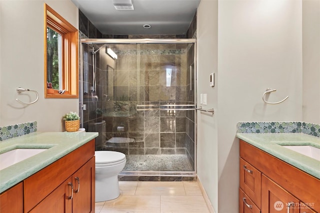 18608 SE 58th St, Issaquah, WA 98027 - bathroom with vanity, a shower stall, and tile patterned flooring