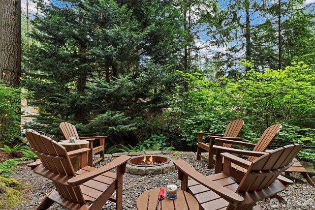 18608 SE 58th St, Issaquah, WA 98027 - view of patio / terrace featuring an outdoor fire pit
