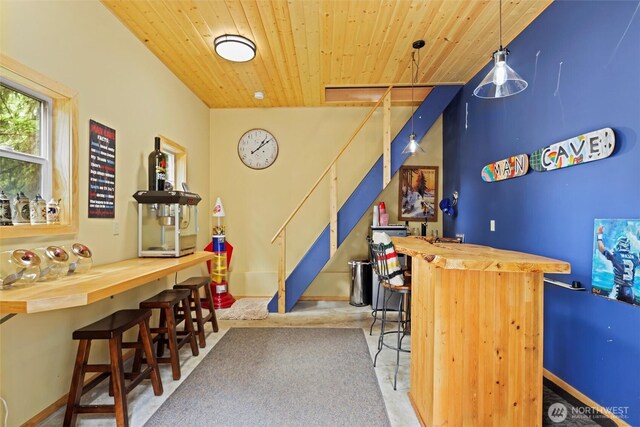 18608 SE 58th St, Issaquah, WA 98027 - indoor dry bar featuring wood ceiling, stairway, and hanging light fixtures