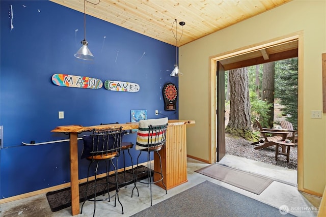 18608 SE 58th St, Issaquah, WA 98027 - indoor dry bar featuring wood ceiling, pendant lighting, and concrete floors
