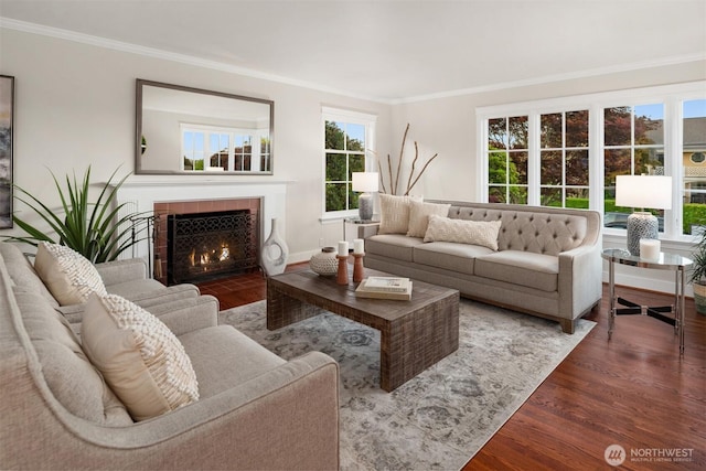 1915 35th Ave W, Seattle, WA 98199 - living room featuring wood finished floors, crown molding, healthy amount of natural light, and a tile fireplace