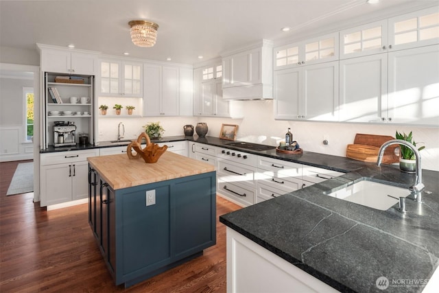 1915 35th Ave W, Seattle, WA 98199 - kitchen with black cooktop, open shelves, white cabinetry, a center island, and recessed lighting