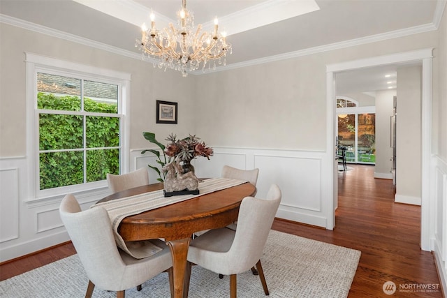 1915 35th Ave W, Seattle, WA 98199 - dining room with wood finished floors, a chandelier, a decorative wall, crown molding, and wainscoting
