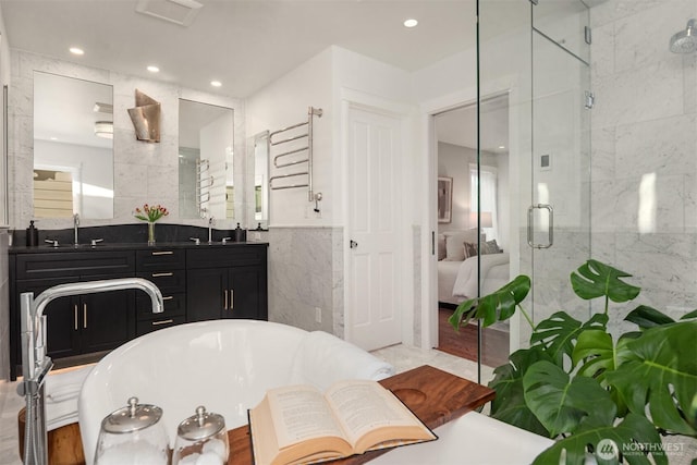 1915 35th Ave W, Seattle, WA 98199 - bathroom with tile walls, a shower stall, a bath, vanity, and recessed lighting