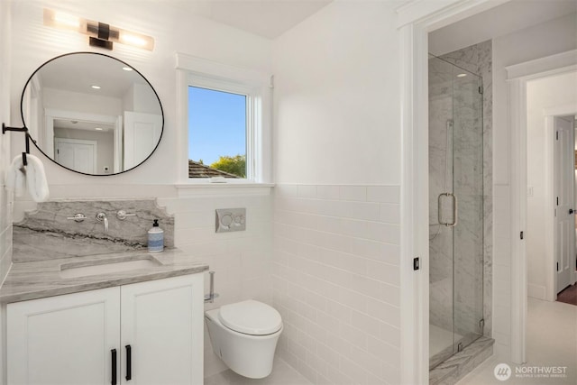1915 35th Ave W, Seattle, WA 98199 - bathroom with tile walls, vanity, a marble finish shower, and a wainscoted wall