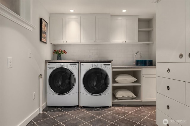 1915 35th Ave W, Seattle, WA 98199 - washroom featuring washing machine and clothes dryer, cabinet space, dark tile patterned flooring, and recessed lighting