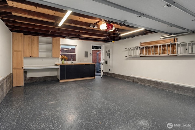 1915 35th Ave W, Seattle, WA 98199 - garage featuring a sink and a garage door opener