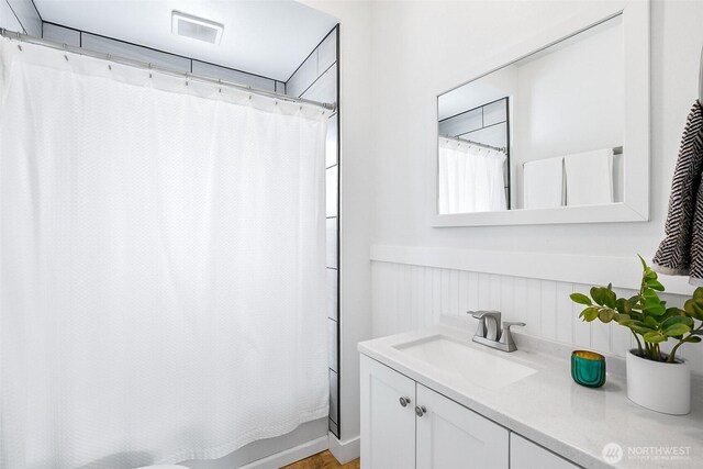 807 24th St, Anacortes, WA 98221 - bathroom with vanity and a wainscoted wall