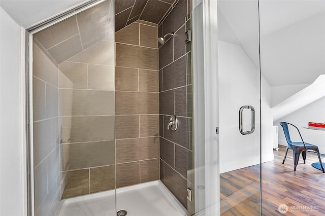 807 24th St, Anacortes, WA 98221 - bathroom with vaulted ceiling, a stall shower, and wood finished floors