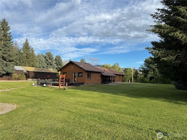 8 Iris Ln, Twisp, WA 98856 - back of property with a yard and a deck