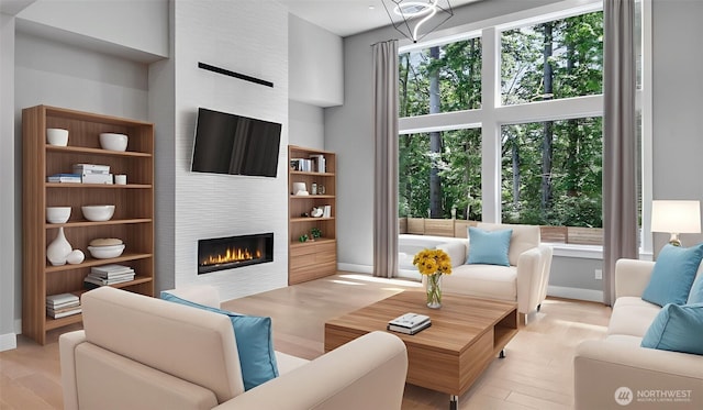 1542 213th Ct NE, Sammamish, WA 98074 - living area featuring a large fireplace and wood finished floors