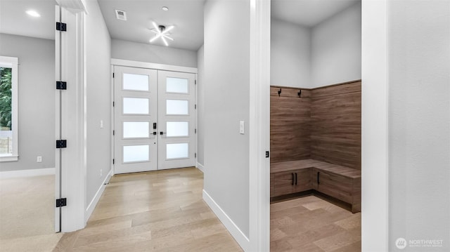 1542 213th Ct NE, Sammamish, WA 98074 - entrance foyer with french doors, plenty of natural light, and light wood-style floors