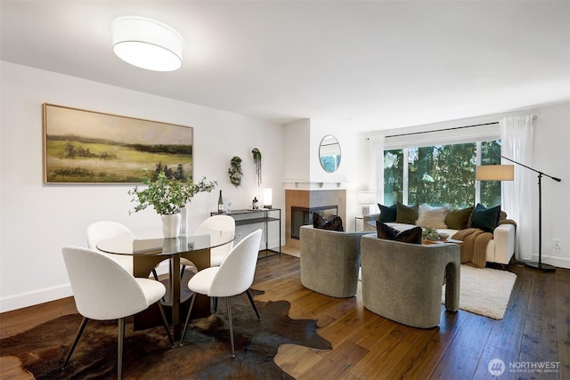 300 N 130th St Unit 2306, Seattle, WA 98133 - dining space featuring wood-type flooring and a tiled fireplace