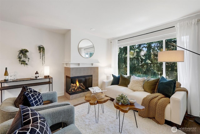 300 N 130th St Unit 2306, Seattle, WA 98133 - living room featuring a tile fireplace and wood finished floors