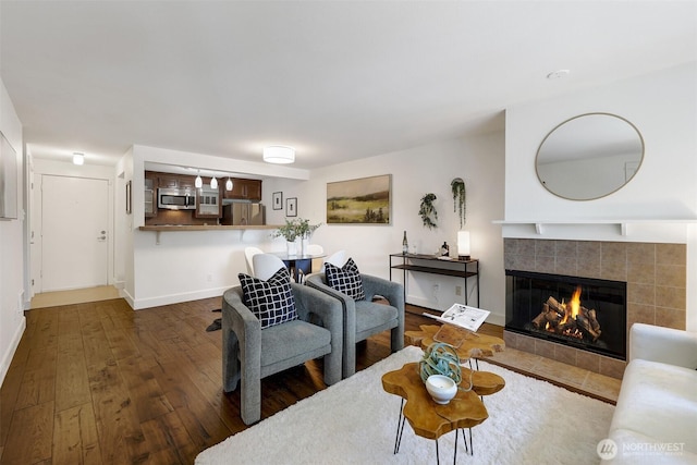300 N 130th St Unit 2306, Seattle, WA 98133 - living area with dark wood-type flooring and a fireplace