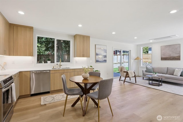 11737 38th Ave NE Unit B, Seattle, WA 98125 - kitchen featuring stainless steel appliances, light brown cabinetry, modern cabinets, light wood finished floors, and recessed lighting