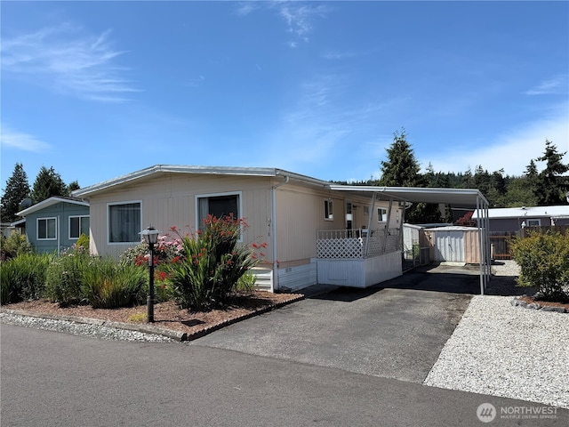1200 Lincoln St Unit 418, Bellingham, WA 98229 - manufactured / mobile home with an attached carport and asphalt driveway