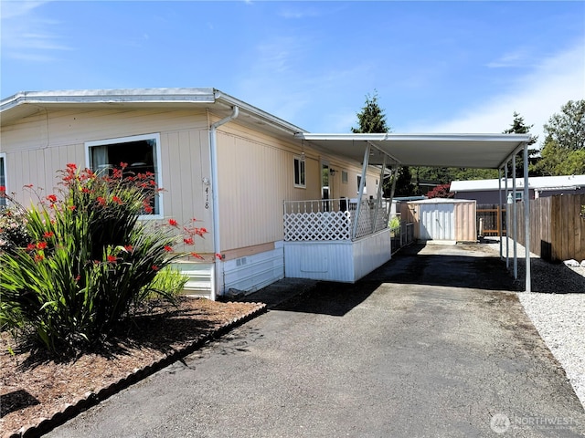 1200 Lincoln St Unit 418, Bellingham, WA 98229 - view of front facade featuring an attached carport, driveway, and crawl space