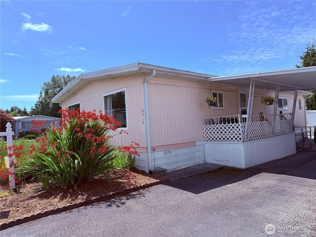 1200 Lincoln St Unit 418, Bellingham, WA 98229 - view of home's exterior featuring crawl space and a carport