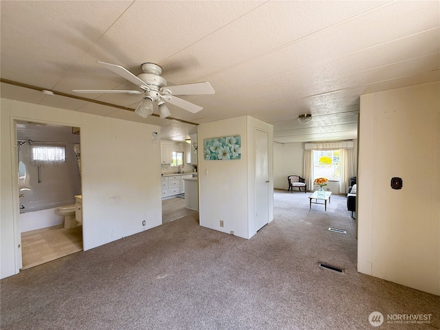 1200 Lincoln St Unit 418, Bellingham, WA 98229 - unfurnished living room featuring carpet flooring and ceiling fan