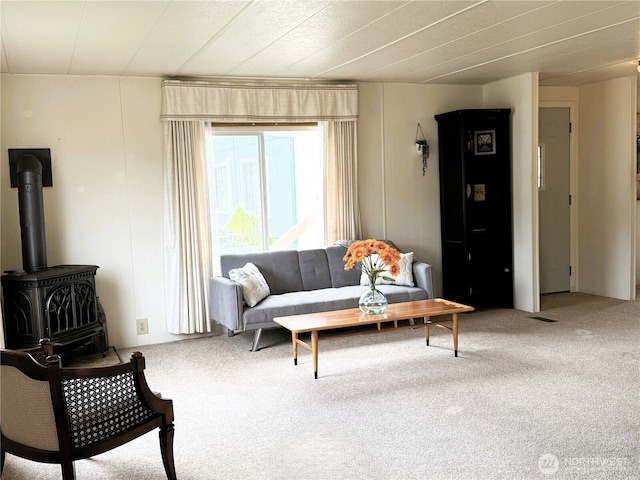 1200 Lincoln St Unit 418, Bellingham, WA 98229 - living room featuring carpet flooring and a wood stove