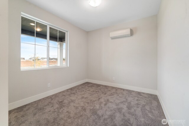 5763 S Sherri Lea Rd, Spokane, WA 99224 - spare room with a wall mounted AC and carpet floors