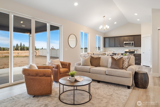 5763 S Sherri Lea Rd, Spokane, WA 99224 - living area featuring light wood-type flooring, a chandelier, healthy amount of natural light, recessed lighting, and vaulted ceiling