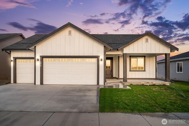 5819 S Sherri Lea Rd, Spokane, WA 99224 - modern inspired farmhouse with an attached garage, driveway, roof with shingles, and a front lawn