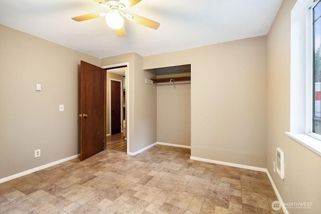 636 Nevil Rd, Winlock, WA 98596 - unfurnished bedroom featuring stone finish flooring, a closet, and a ceiling fan