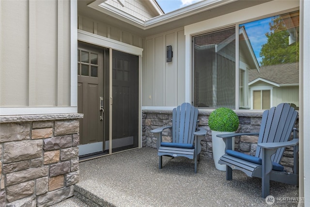 9002 Gleneagle Dr, Blaine, WA 98230 - view of exterior entry featuring stone siding and board and batten siding