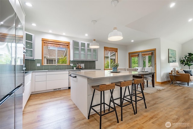 9002 Gleneagle Dr, Blaine, WA 98230 - kitchen with stainless steel appliances, tasteful backsplash, white cabinets, a kitchen island, and recessed lighting