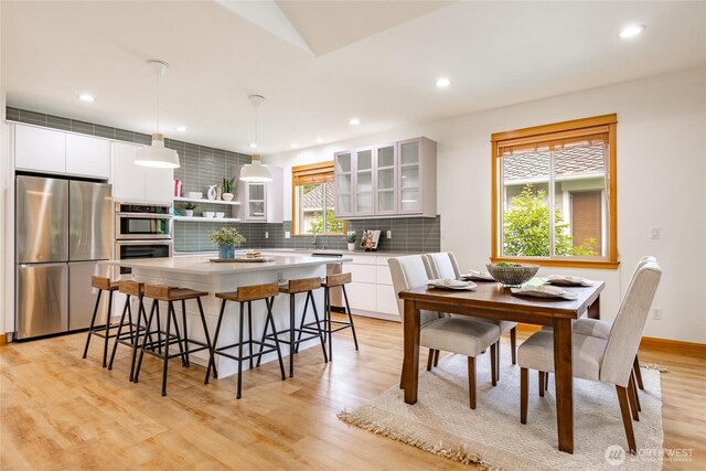 9002 Gleneagle Dr, Blaine, WA 98230 - dining room with light wood finished floors and recessed lighting