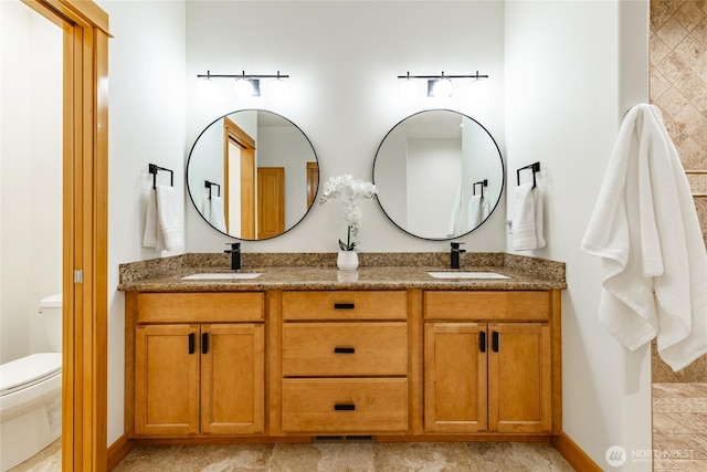 9002 Gleneagle Dr, Blaine, WA 98230 - bathroom featuring double vanity and toilet