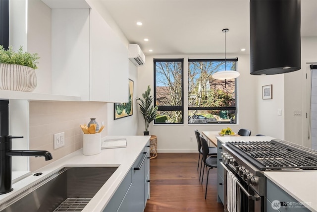 8054A Brooklyn Ave NE, Seattle, WA 98115 - kitchen featuring an AC wall unit, stainless steel range, decorative backsplash, dark wood-style flooring, and light countertops
