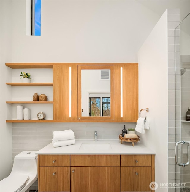 8054A Brooklyn Ave NE, Seattle, WA 98115 - full bathroom featuring vanity, tasteful backsplash, and a shower with shower door