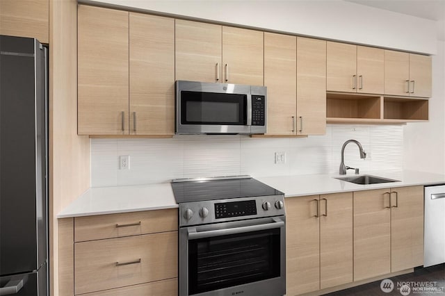 11903 NE 128th St Unit 205, Kirkland, WA 98034 - kitchen with stainless steel appliances, light brown cabinets, tasteful backsplash, and light countertops