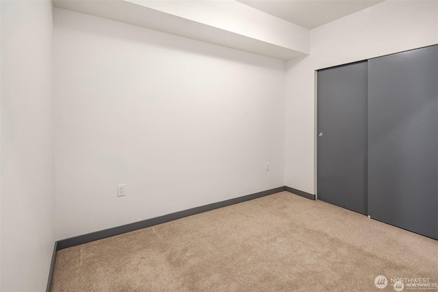11903 NE 128th St Unit 205, Kirkland, WA 98034 - unfurnished bedroom with light colored carpet and a closet