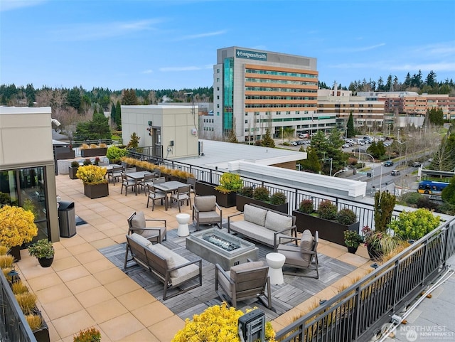 11903 NE 128th St Unit 205, Kirkland, WA 98034 - view of patio featuring an outdoor living space with a fire pit