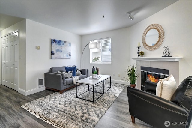 5000 Lake Washington Blvd NE Unit B201, Renton, WA 98056 - living room with wood finished floors and a tile fireplace