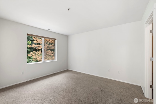 21270 40th Way S Unit 35, Seatac, WA 98198 - spare room featuring a pendent fire sprinkler and carpet