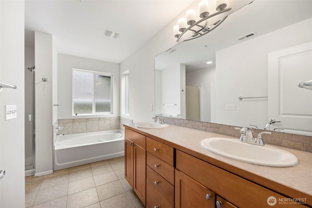 21270 40th Way S Unit 35, Seatac, WA 98198 - full bathroom featuring a garden tub, double vanity, tile patterned floors, and a shower stall