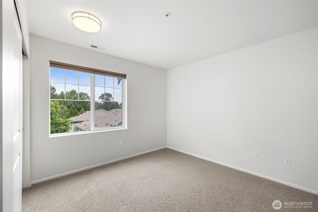21270 40th Way S Unit 35, Seatac, WA 98198 - spare room with baseboards and carpet flooring