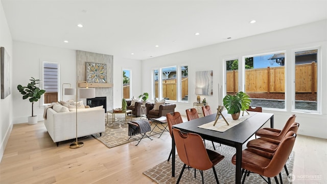 1118 N 34th St, Renton, WA 98056 - dining space featuring light wood finished floors, recessed lighting, and a fireplace