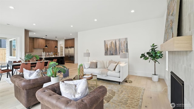 1118 N 34th St, Renton, WA 98056 - living room with light wood-style floors, recessed lighting, and a fireplace